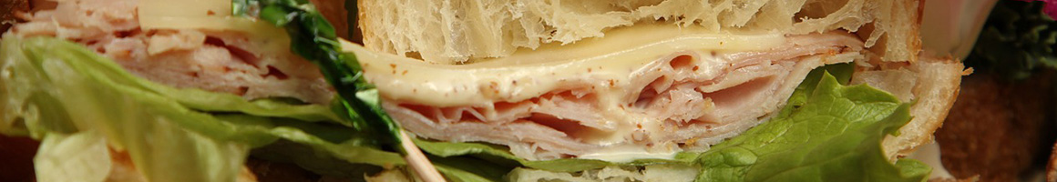Eating Deli Sandwich Salad at Uptown Deli restaurant in Richmond Hill, GA.